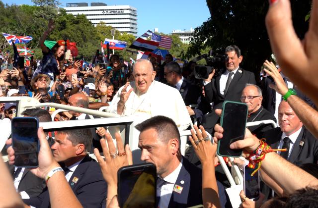Pope Francis  waves to young people at the opening of World Youth Day 2023 in Lisbon, Portugal. (Photo by Erin Everson)