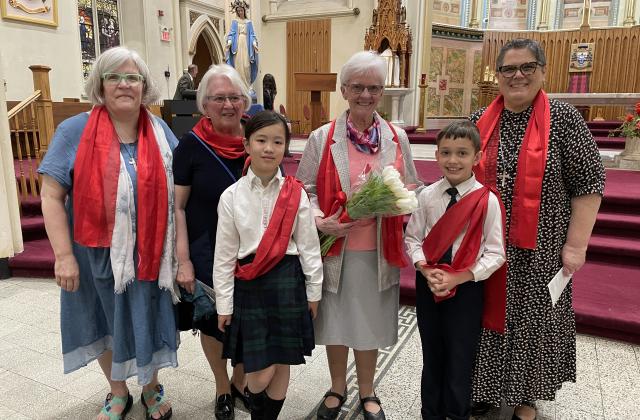 RSCJ with students at Anniversary Mass (Photo by Barb Martell)